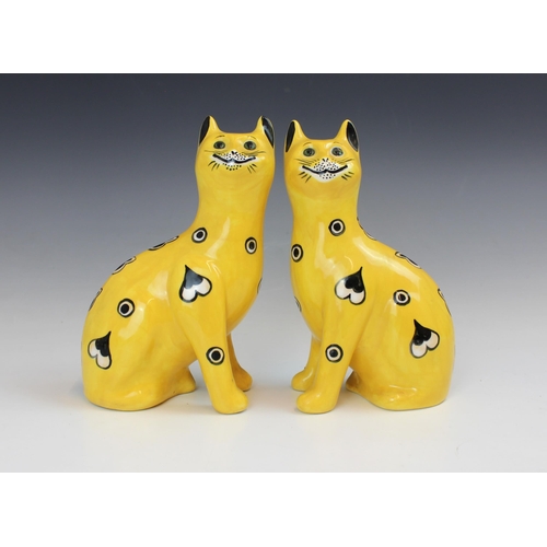 602 - A pair of Griselda Hill Pottery Wemyss cats, 21st century, painted with heart and circular motifs to... 