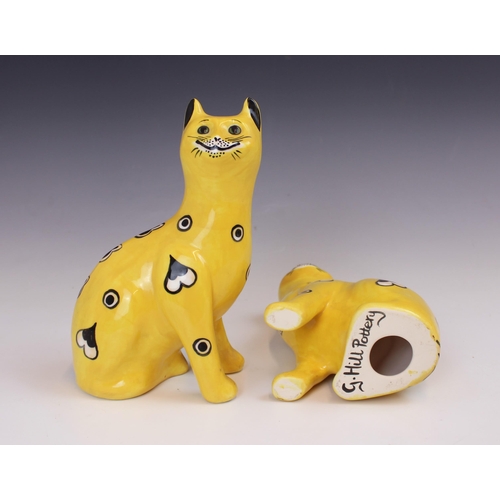 602 - A pair of Griselda Hill Pottery Wemyss cats, 21st century, painted with heart and circular motifs to... 