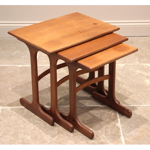 625 - A G-Plan nest of three teak tables, mid 20th century, the rectangular tops upon trestle type support... 