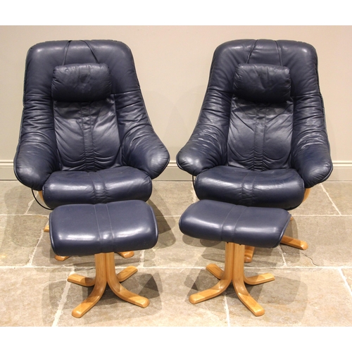 647 - A pair of blue leather revolving and reclining ‘Stressless’ type armchairs, each raised upon five be... 