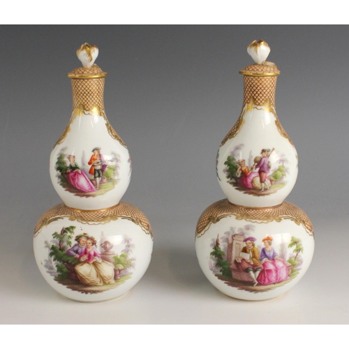 674 - A pair of Augustus Rex double gourd vases and stoppers, 19th century, each decorated with scenes of ... 