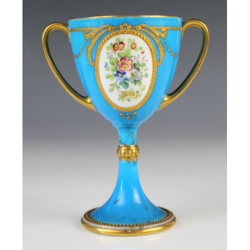 679 - A Minton turquoise twin handled cup, early 20th century, with a polychrome floral reserve to one sid... 