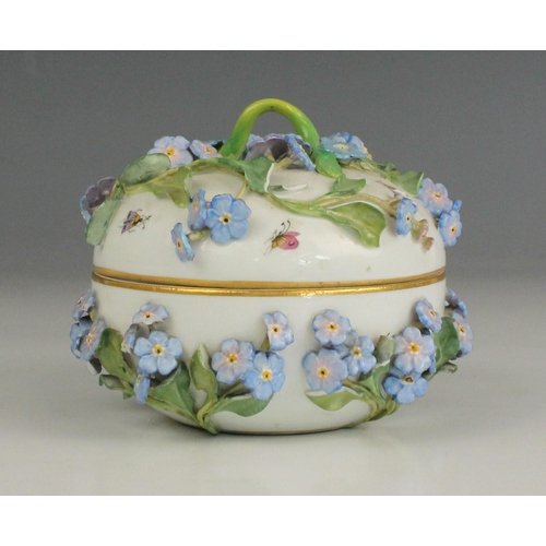 691 - A Meissen forget-me-not dressing table jar and cover, 19th century, florally encrusted with forget m... 