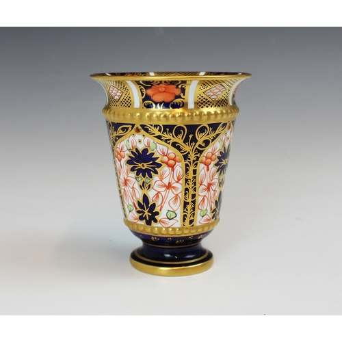 695 - A Royal Crown Derby pattern 1128 vase, date code for 1918, of conical form with flared rim on a circ... 