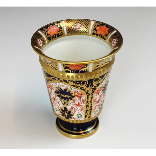 695 - A Royal Crown Derby pattern 1128 vase, date code for 1918, of conical form with flared rim on a circ... 