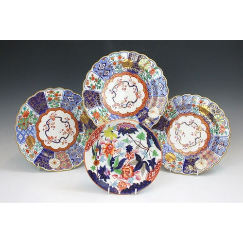 710 - Three Derby plates, late 18th/early 19th century, each decorated in the imari pattern, gilt scallope... 