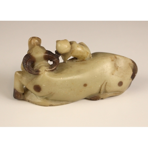 783 - A Chinese carved soapstone model of a buffalo, late 19th century, modelled recumbent with a monkey a... 