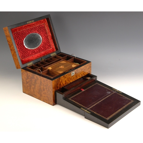 951 - A 19th century burr yew jewellery/writing box, the hinged cover centred with a shield shaped cartouc... 