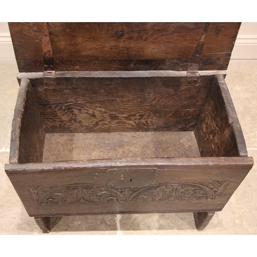 979 - A 17th century oak six plank oak coffer bach, the hinged cover with a serrated edge and iron clasp l... 