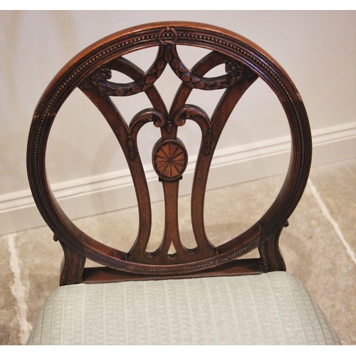 1008 - A George II style walnut elbow chair, late 19th/early 20th century, the carved shell crest uniting a... 