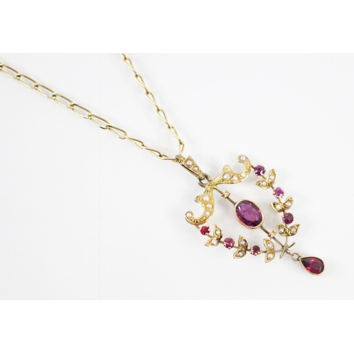 165 - An Edwardian style untested amethyst pendant, the central oval cut amethyst within a seed pearl and ... 