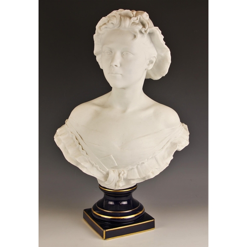 658 - A Limoges bisque bust, 20th century, modelled as a young lady wearing a bonnet, signed Alex Duverger... 