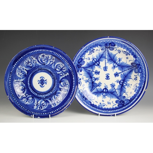 659 - An Italian faience blue and white tin glazed earthenware charger, late 19th century, the well painte... 