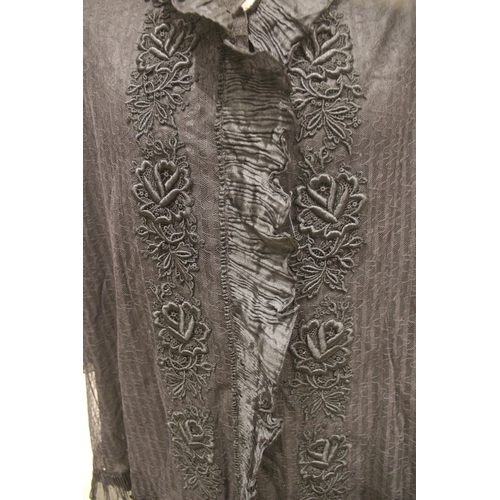 912 - An early 20th century dressing jacket, the black lace jacket with ruffle silk edging to the cuffs an... 