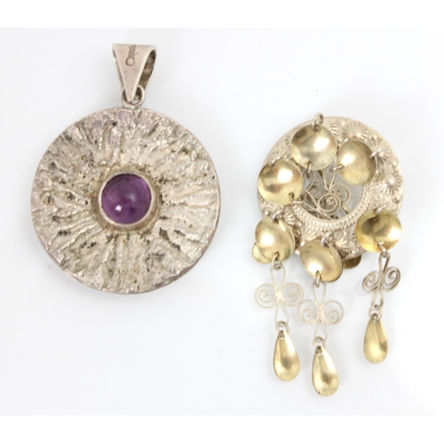 158 - A Pentti Sarpaneva silver pendant, the circular pendant with bark effect detail and central amethyst... 