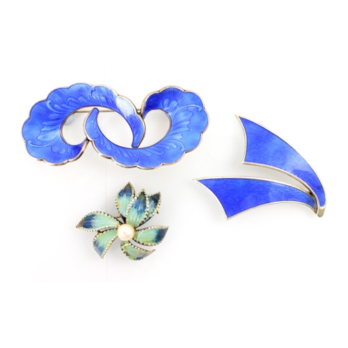 175 - An enamel and silver brooch by Ivar T Holth, the stylised double swirl with applied blue guilloche e... 