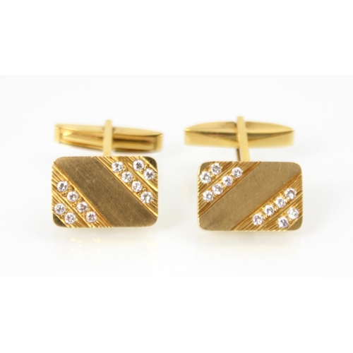 180 - A pair of yellow metal and diamond cufflinks, the rectangular cufflinks set with twelve round cut di... 