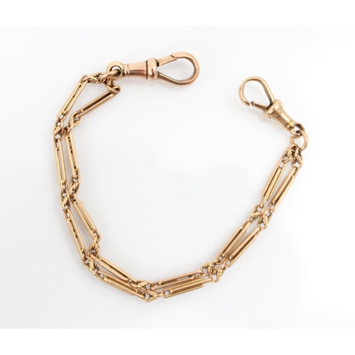 197 - A 9ct yellow gold bracelet, the fancy double link chain with twisted detail, lobster fastener to eac... 