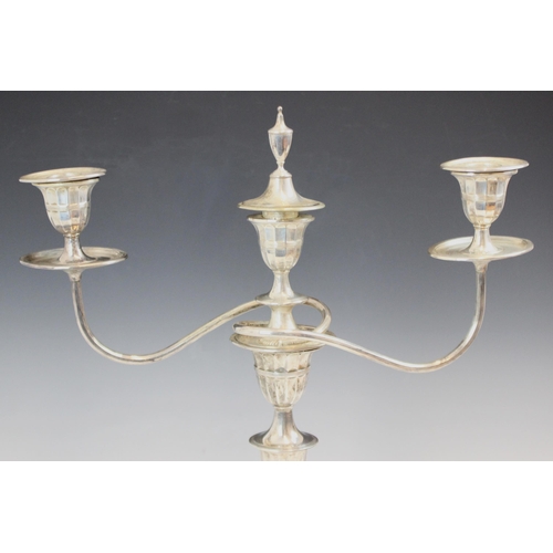 20 - A pair of Edwardian silver candelabra, Hawksworth, Eyre & Co Ltd, Sheffield 1905, the three urn shap... 