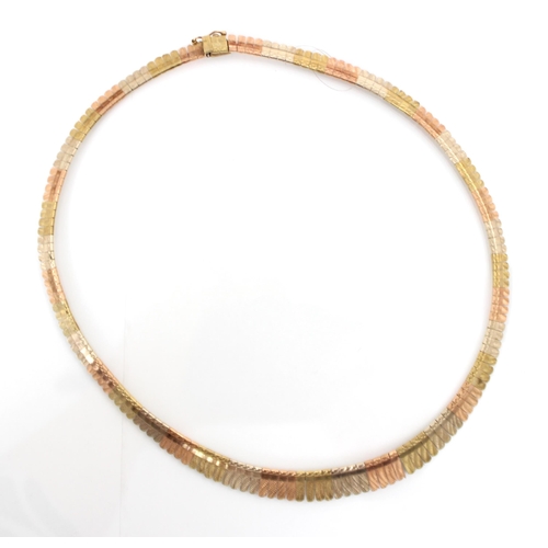 202 - A multi tone 9ct yellow gold collar necklace, the necklace designed as a fringe with planished gradu... 