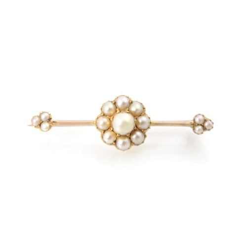 205 - A Victorian style split pearl brooch, the raised central motif designed as a flowerhead with split p... 