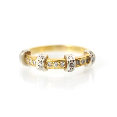 213 - An 18ct yellow gold diamond ring, the band ring with four raised white metal diamond set sections up... 