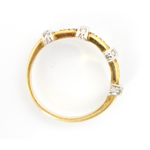 213 - An 18ct yellow gold diamond ring, the band ring with four raised white metal diamond set sections up... 