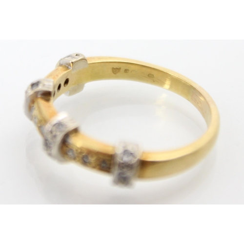 213 - An 18ct yellow gold diamond ring, the band ring with four raised white metal diamond set sections up... 