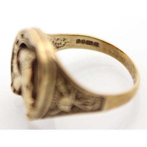 215 - A 9ct yellow gold ring, the head of the ring modelled as a  horseshoe with horse head detail to cent... 