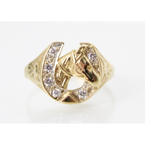 222 - A 9ct yellow gold diamond set dress ring, the raised head designed as horseshoe with six round cut d... 