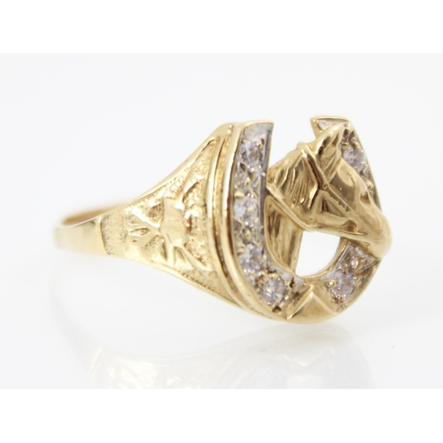 222 - A 9ct yellow gold diamond set dress ring, the raised head designed as horseshoe with six round cut d... 