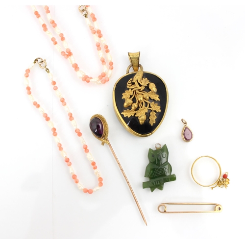 232 - A selection of yellow metal jewellery, including a gold coloured mounted mourning locket, with acorn... 