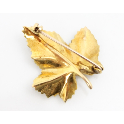 235 - A 9ct yellow gold novelty brooch, modelled as a maple leaf with engraved realistic detail, with hing... 