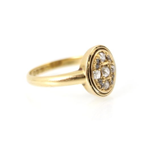 237 - An early 20th century 18ct yellow gold diamond ring, the central oval head set with old cuts and ros... 