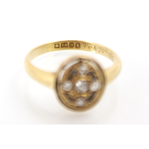 237 - An early 20th century 18ct yellow gold diamond ring, the central oval head set with old cuts and ros... 