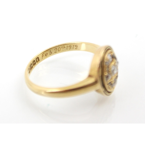 237 - An early 20th century 18ct yellow gold diamond ring, the central oval head set with old cuts and ros... 