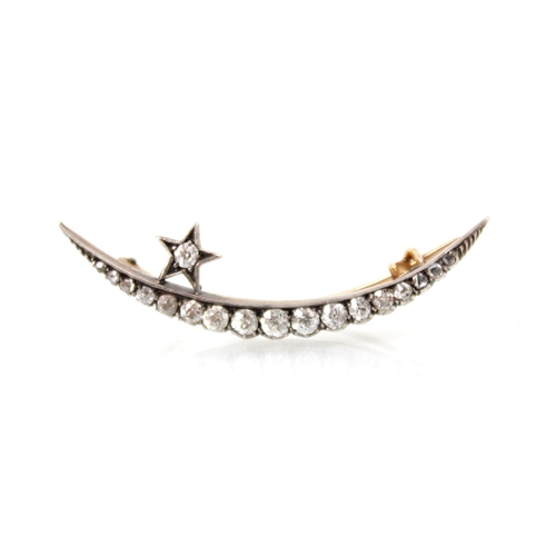 240 - An early 20th century diamond brooch, the crescent shaped brooch set with graduated old cut diamonds... 