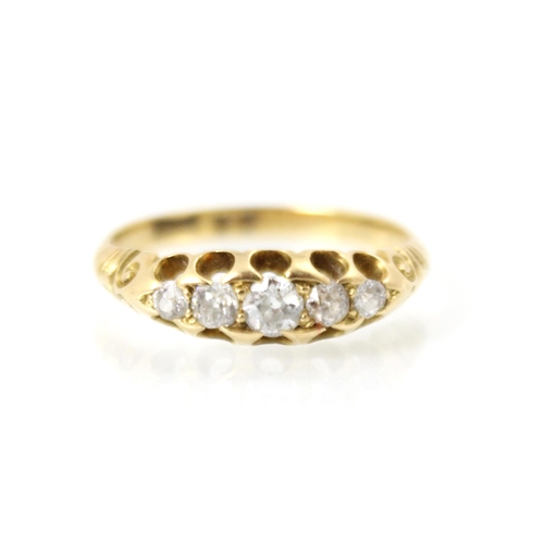 242 - A 20th century diamond five stone ring, the five graduated old cut diamonds within openwork mount le... 