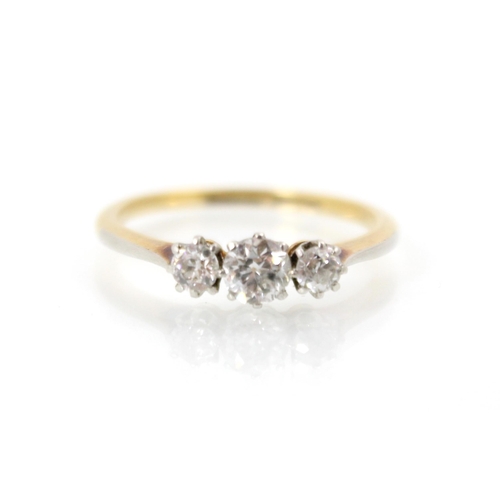 243 - An Edwardian style diamond three stone ring, the central old cut diamond with smaller diamond to eac... 