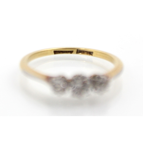 243 - An Edwardian style diamond three stone ring, the central old cut diamond with smaller diamond to eac... 