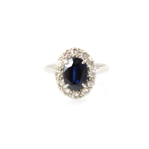 268 - An Edwardian style untested sapphire and diamond cluster ring over cut sapphire set within surround ... 