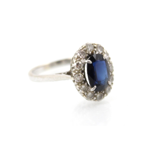 268 - An Edwardian style untested sapphire and diamond cluster ring over cut sapphire set within surround ... 