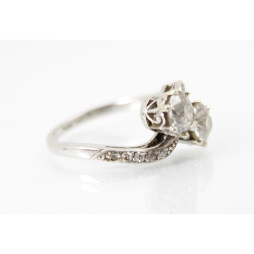 271 - An early 20th century diamond 'toi et moi' ring, the two old cut diamonds claw set in white metal wi... 