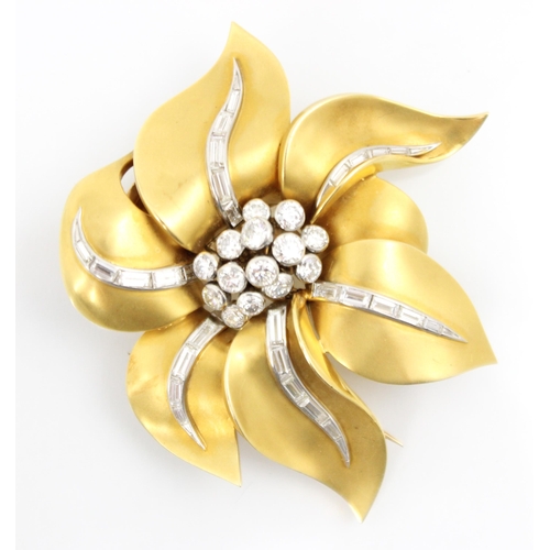 290 - A yellow metal and diamond set brooch, the stylised matte petals with flowing line of baguette cut d... 