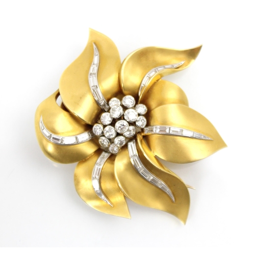 290 - A yellow metal and diamond set brooch, the stylised matte petals with flowing line of baguette cut d... 