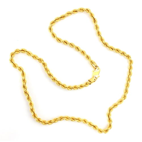 301 - A yellow metal rope twist chain, the chain with hook fitting stamped 'MC 916' overall length 44cm, 1... 