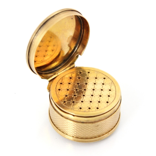 321 - A 20th century gold coloured vinaigrette, the circular hinged cover with concentric engine turned de... 