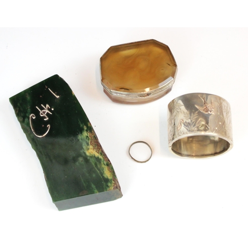 332 - An octagonal banded agate trinket box, mounted with silver coloured metal, 7.5cm long, a nephrite co... 