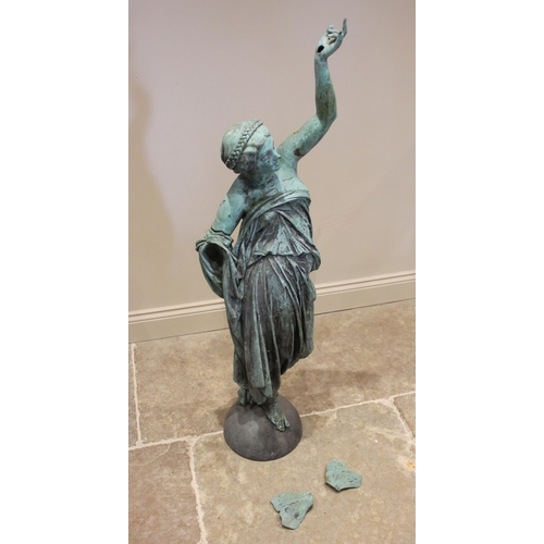 378 - An oxidised bronze statue of the goddess Victory or Nike, modelled wearing a robe with left arm rais... 