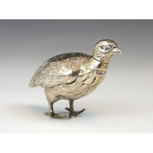 62 - A George V silver novelty pepperette, 'RHH' Sheffield 1925, the pepperette modelled as a game bird w... 